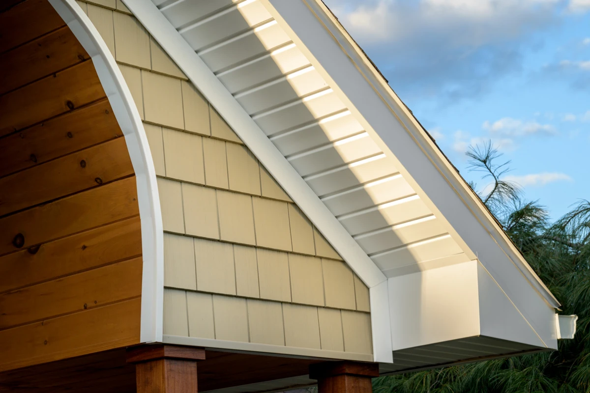 Painted gable trim over shake siding