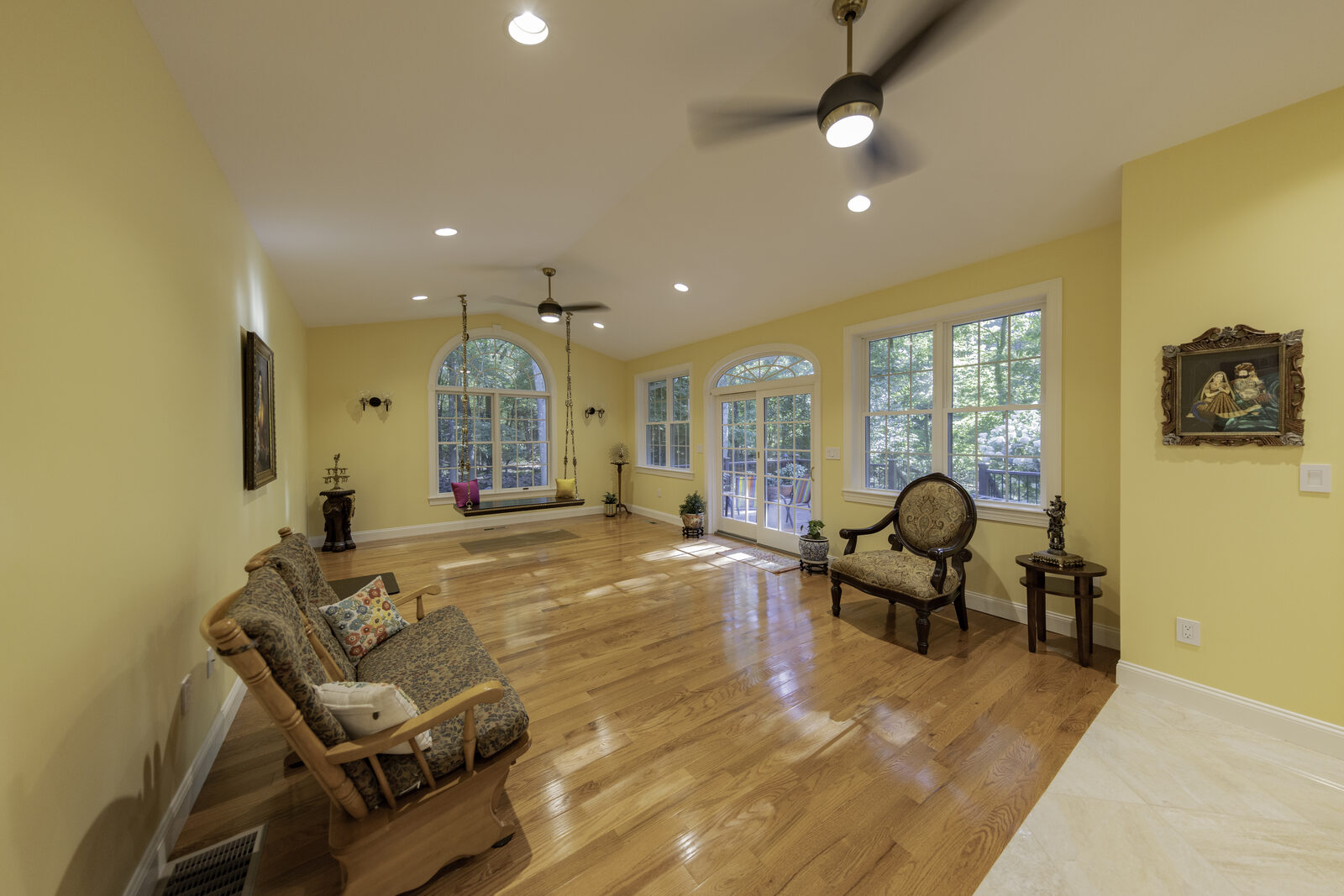 A new great room lit by three arched windows